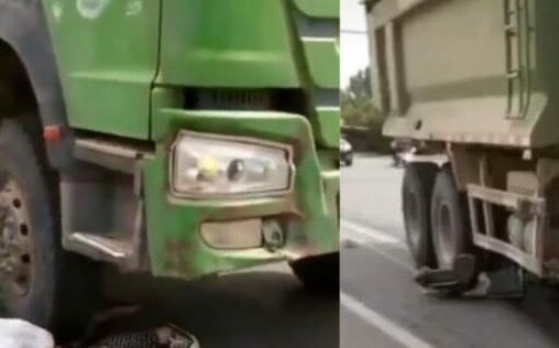 Mulher fica presa debaixo de roda de caminhão e a população grava o desespero dela; cenas fortes